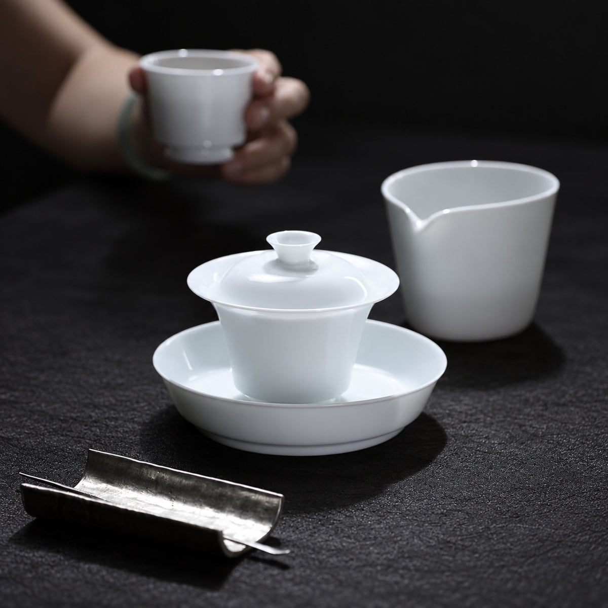 White porcelain gaiwan in a tea setting