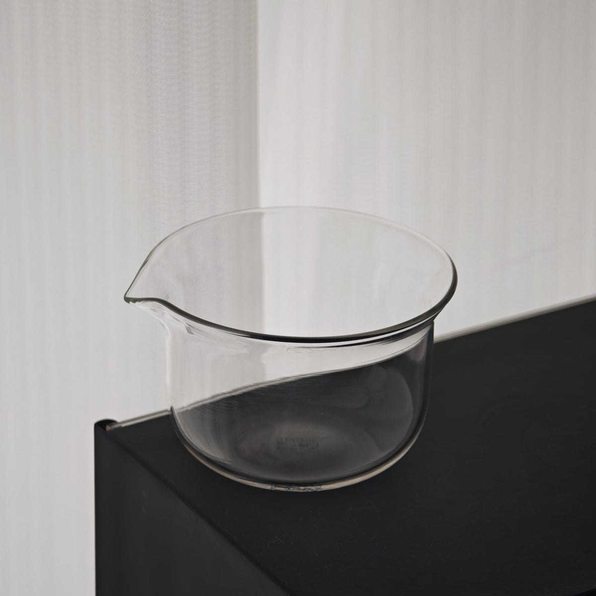 Clear glass pitcher from the travel tea set