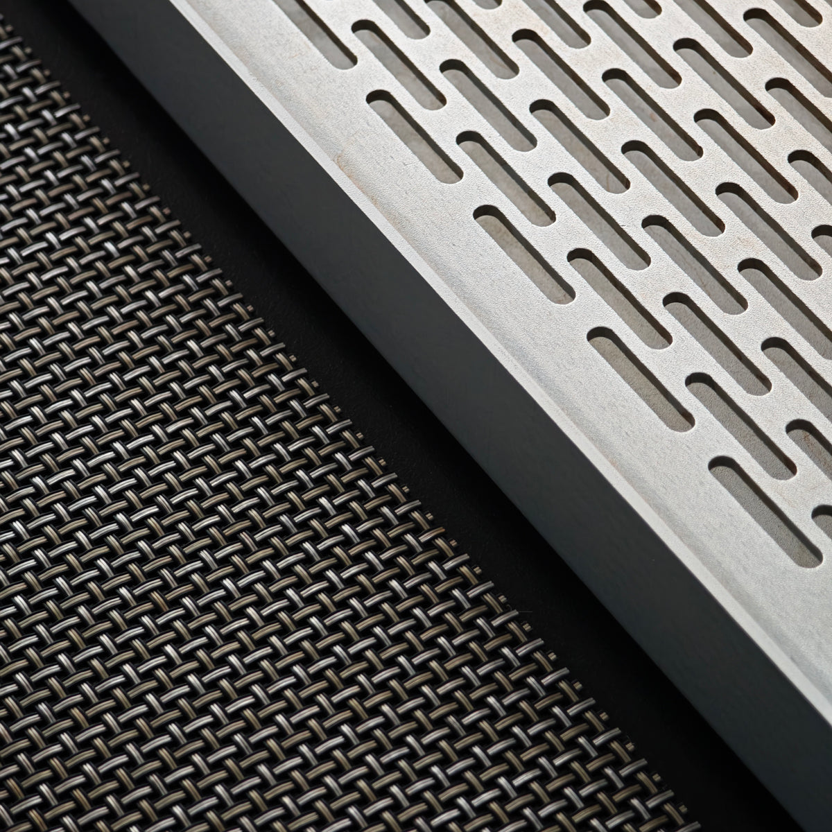 Close-up of the tea tray slots and woven mat texture