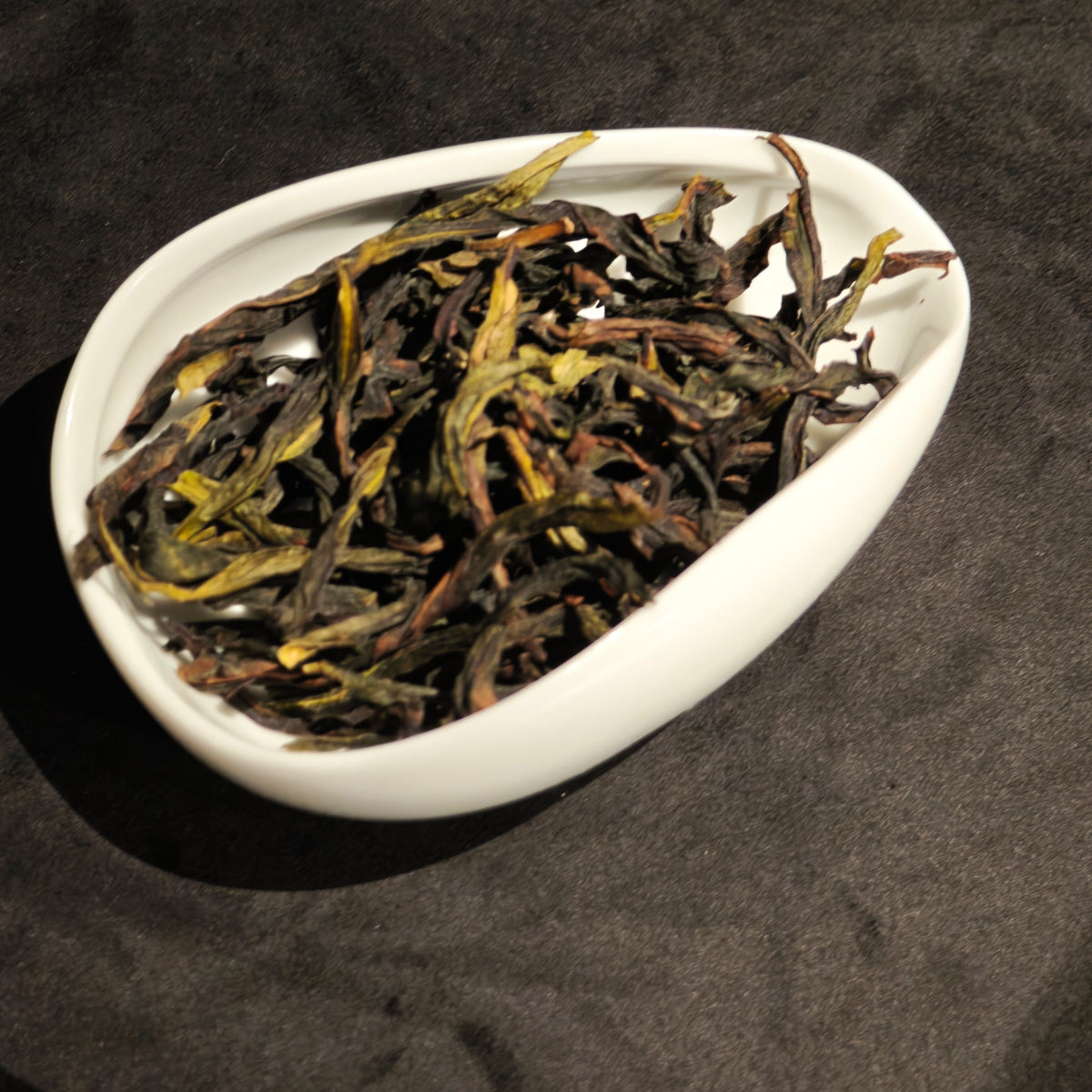 Close-up of opened Ya Shi Xiang tea leaves