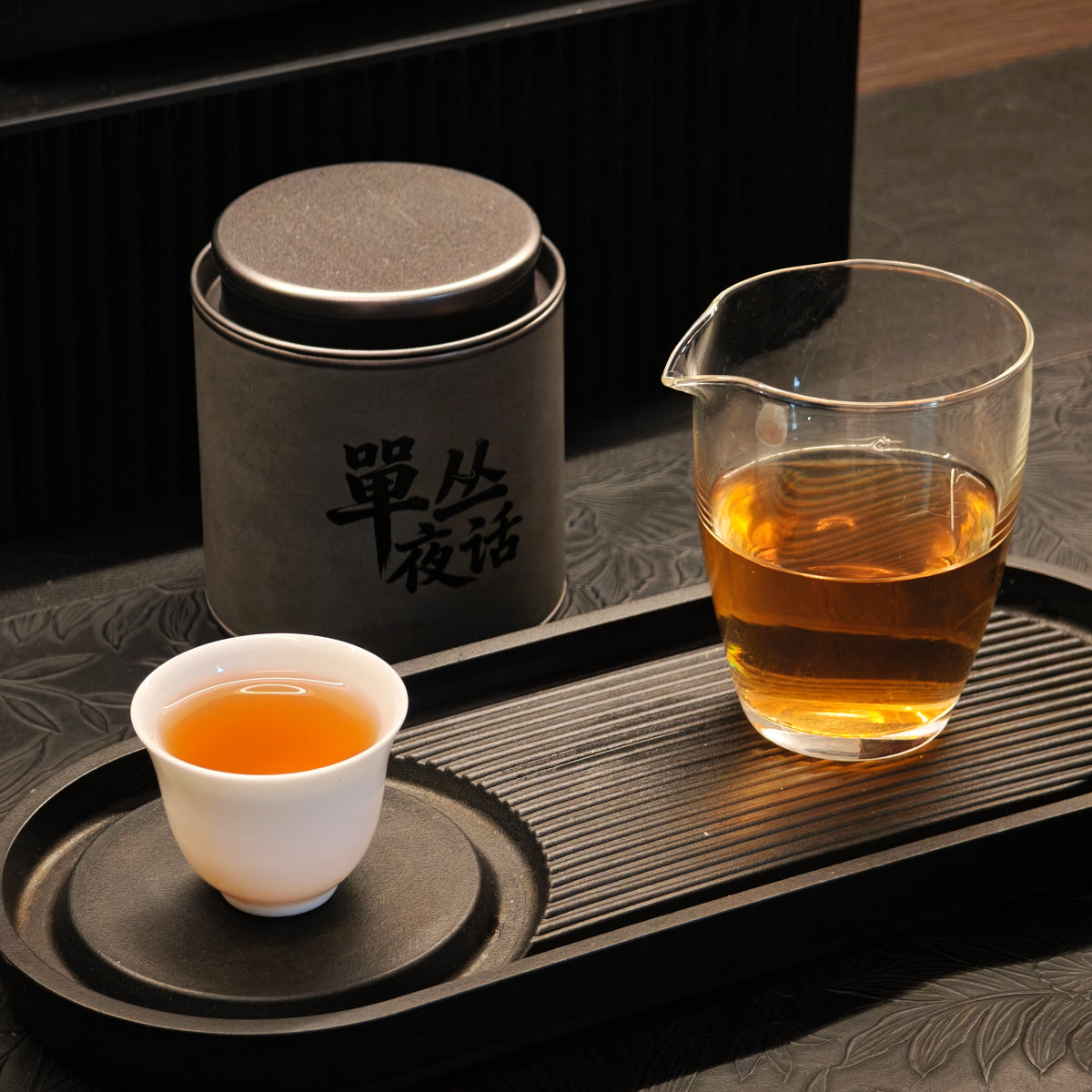 Honey Orchid tea arranged with a cup and glass pitcher