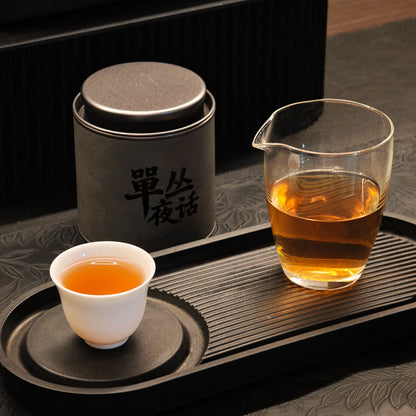 Honey Orchid tea arranged with a cup and glass pitcher