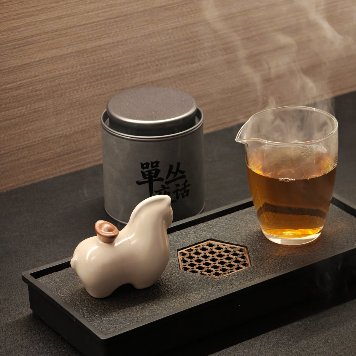 Honey Orchid tea tin beside a glass of brewed tea
