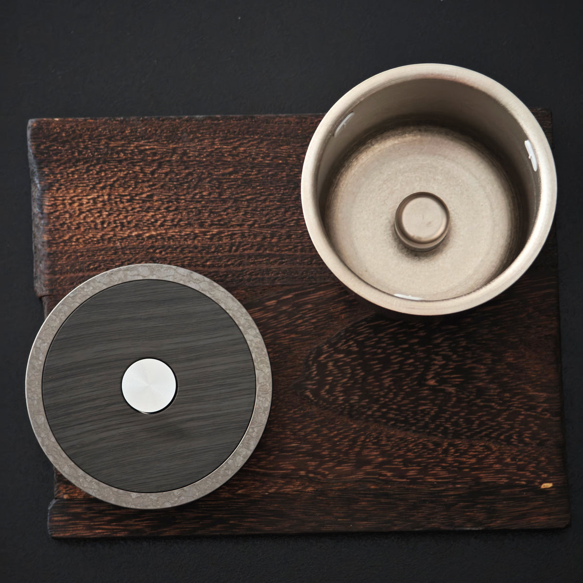 Titanium brewing chamber and lid shown separately