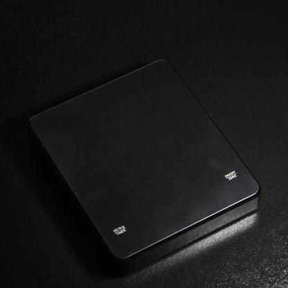 Angled view of the black digital tea scale
