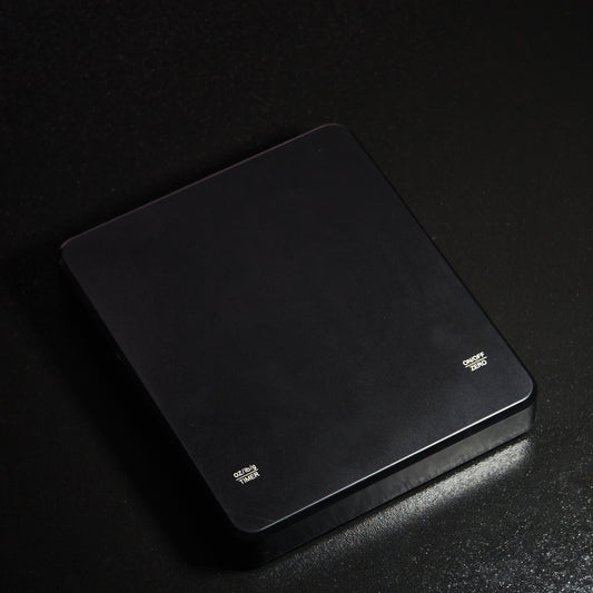 Angled view of the black digital tea scale