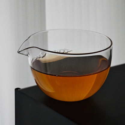 Clear glass tea pitcher filled with amber tea