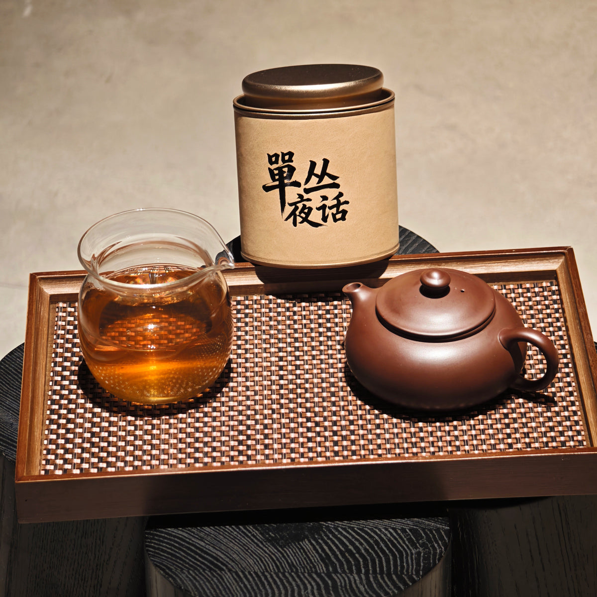Song Zhong tea tin beside a pitcher and small teapot