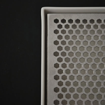 Close-up of the white porcelain rim and removable insert