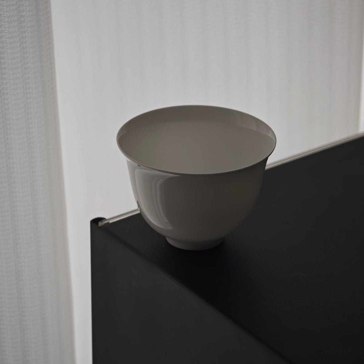 Side view of a white gongfu teacup