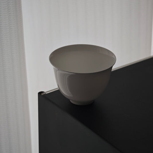 Side view of a white gongfu teacup
